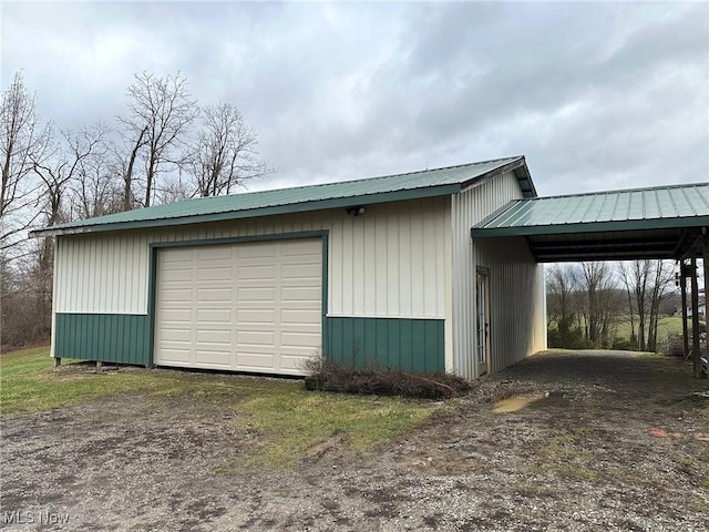 garage featuring a carport