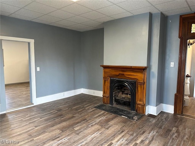 unfurnished living room featuring dark hardwood / wood-style floors