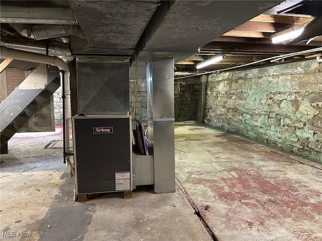 basement featuring heating unit