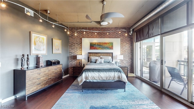 21 Furnace St Unit 705, Akron, OH 44308 - bedroom featuring dark wood-style floors, access to outside, brick wall, and track lighting