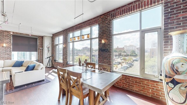21 Furnace St Unit 705, Akron, OH 44308 - sunroom / solarium featuring brick wall and wood finished floors
