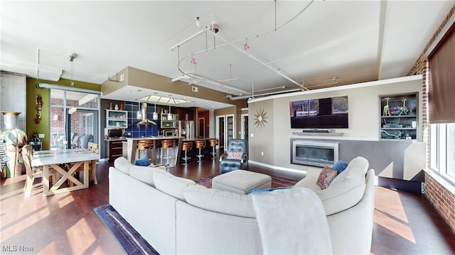 21 Furnace St Unit 705, Akron, OH 44308 - living area featuring wood finished floors, a glass covered fireplace, and baseboards