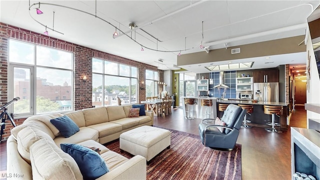 21 Furnace St Unit 705, Akron, OH 44308 - living area with dark wood-style flooring and brick wall