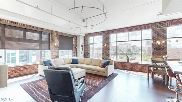 21 Furnace St Unit 705, Akron, OH 44308 - living room with brick wall, wood finished floors, and track lighting