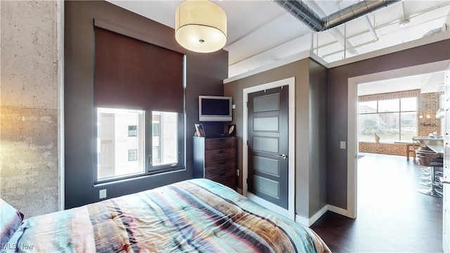21 Furnace St Unit 705, Akron, OH 44308 - bedroom featuring dark wood-style flooring and baseboards