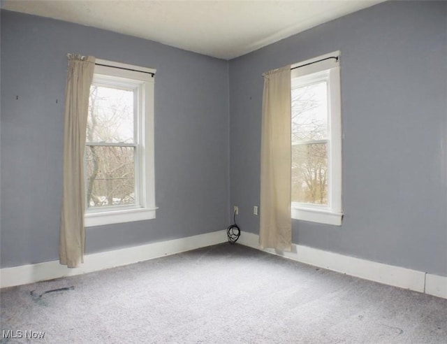 unfurnished room featuring carpet flooring