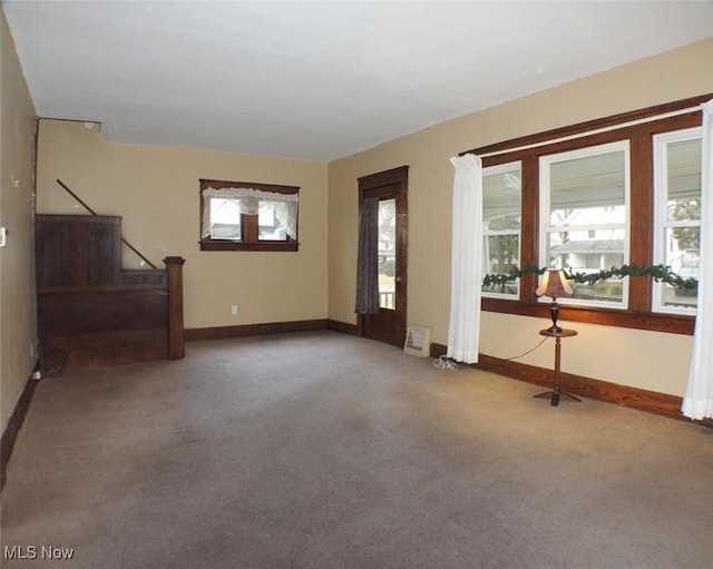 unfurnished living room with carpet flooring