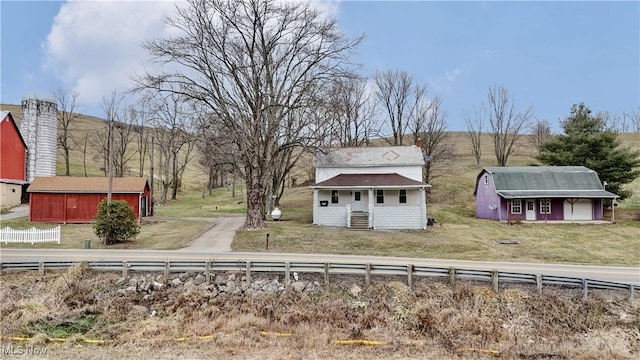 view of front of home with an outbuilding