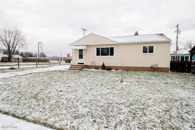 view of snow covered house