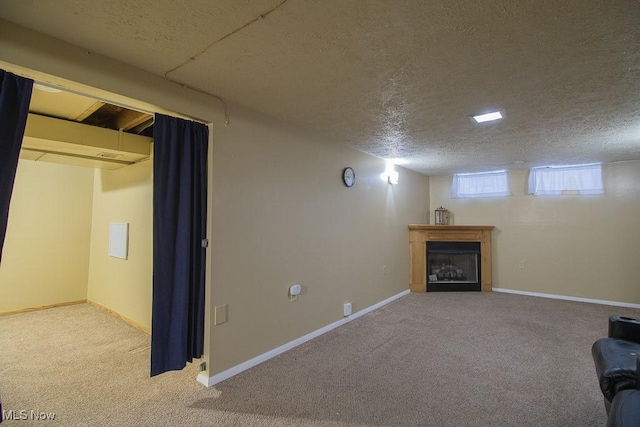 interior space with carpet floors and a textured ceiling