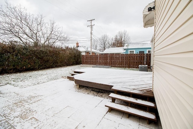 snow covered deck featuring central AC