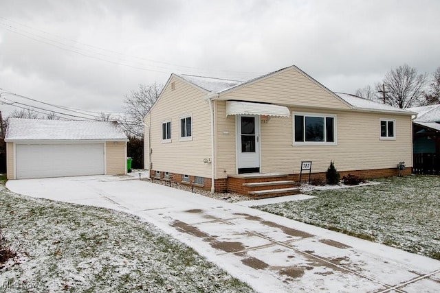 view of front of home with a garage and an outdoor structure