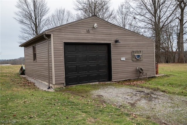 garage featuring a lawn