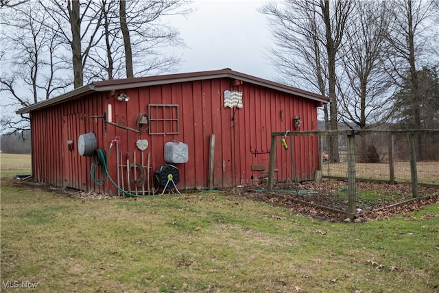 view of outdoor structure with a lawn