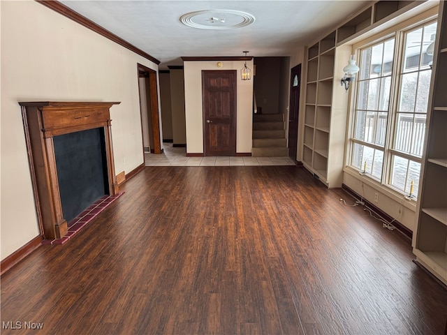 4175 E Middletown Rd, New Middletown, OH 44442 - unfurnished living room with wood finished floors, stairs, baseboards, and ornamental molding