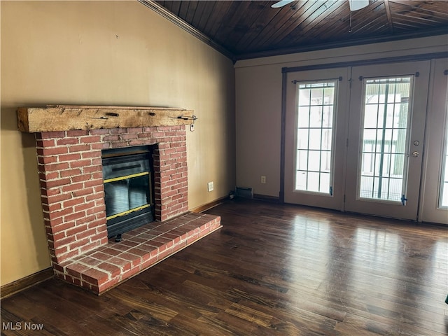 unfurnished living room featuring dark hardwood / wood-style flooring, a brick fireplace, ornamental molding, and wooden ceiling