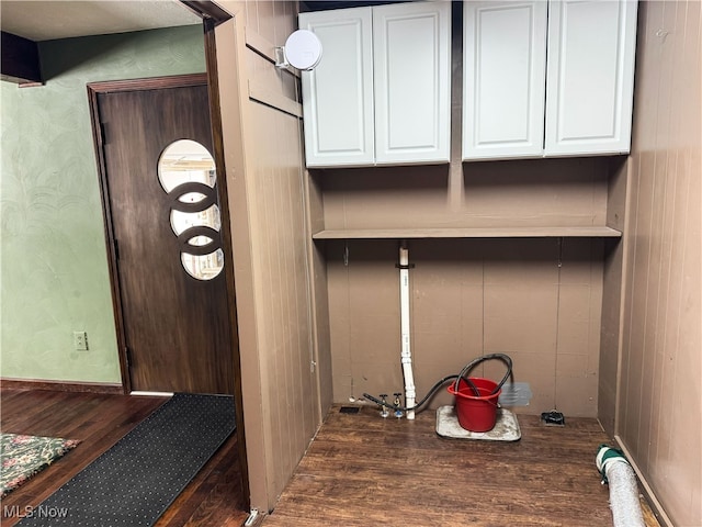 mudroom with dark hardwood / wood-style floors