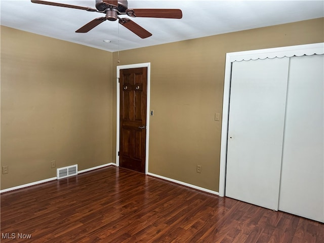 4175 E Middletown Rd, New Middletown, OH 44442 - unfurnished bedroom featuring wood finished floors, baseboards, a ceiling fan, and a closet
