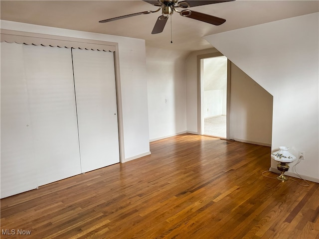 bonus room with ceiling fan and hardwood / wood-style floors