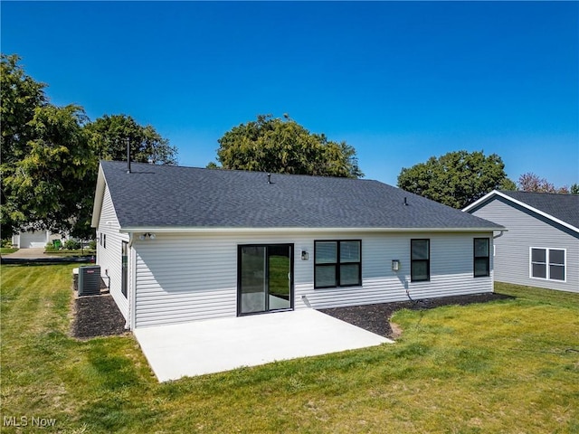 back of house with a patio, cooling unit, and a lawn