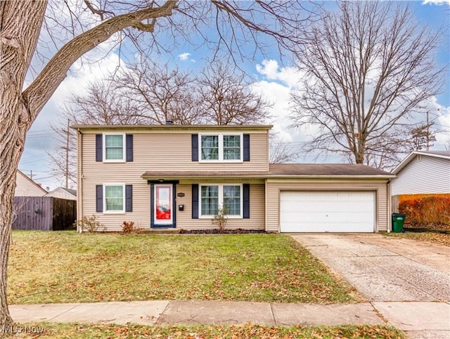 view of front of house featuring a garage and a front yard