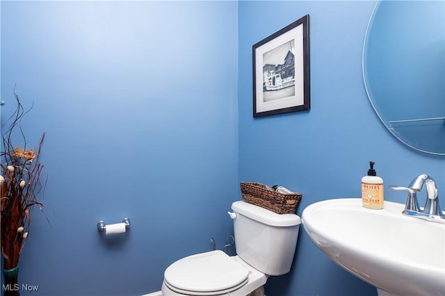 bathroom with toilet and sink