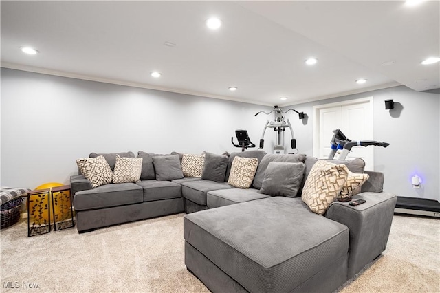 carpeted living room featuring crown molding