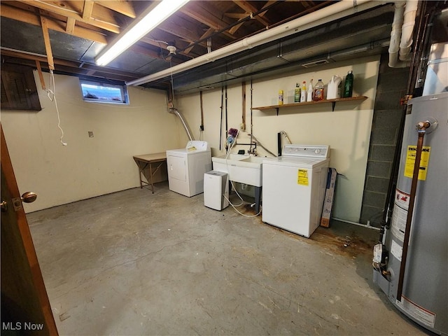 basement with sink, separate washer and dryer, and water heater