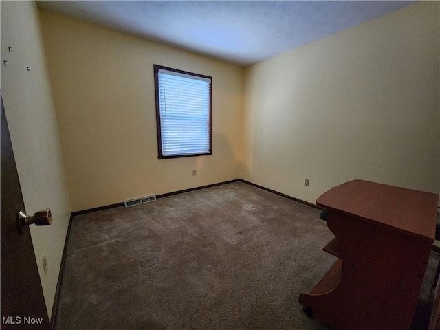 empty room featuring carpet floors