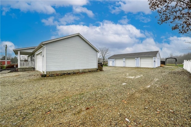 view of home's exterior with an outbuilding and a garage