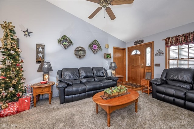 living room featuring ceiling fan, carpet, and lofted ceiling