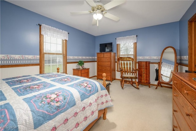 bedroom featuring ceiling fan and light colored carpet