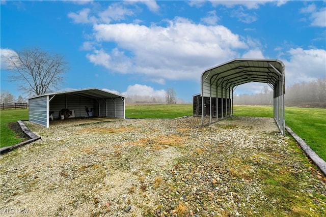 view of outbuilding with a carport and a lawn