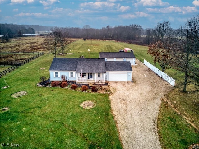 birds eye view of property with a rural view