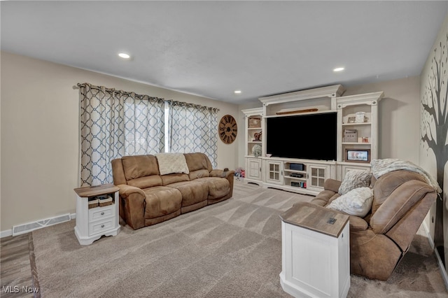 living room featuring light colored carpet