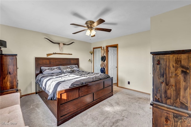 bedroom featuring ceiling fan and light colored carpet