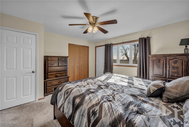 bedroom with ceiling fan and light carpet