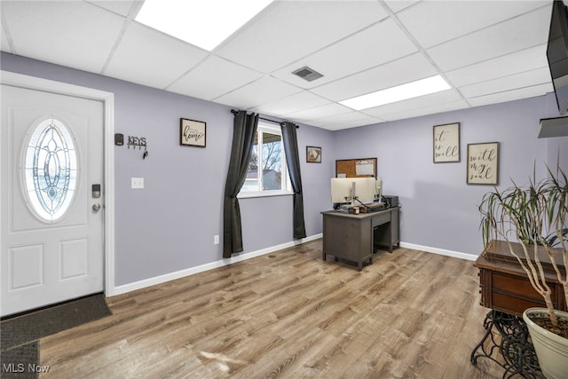 entrance foyer with a paneled ceiling and wood-type flooring