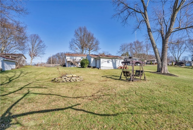 view of yard featuring a wooden deck