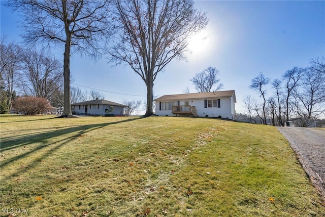 single story home with a front yard