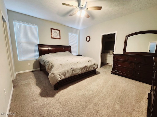 bedroom with light carpet and ceiling fan