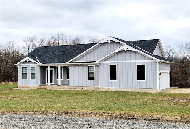 view of front facade with a garage and a front lawn