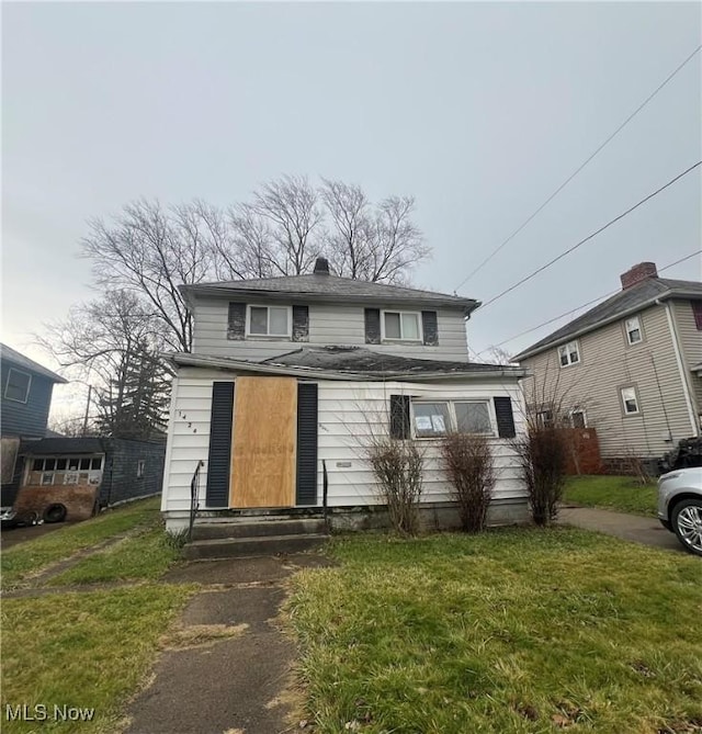 front facade with a front lawn