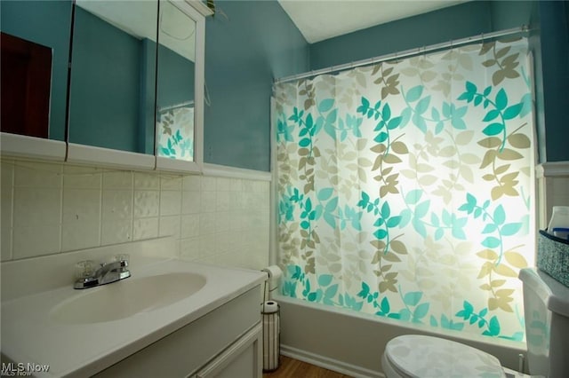 full bathroom with backsplash, vanity, shower / bath combination with curtain, and toilet