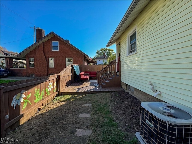 view of yard featuring a deck and cooling unit