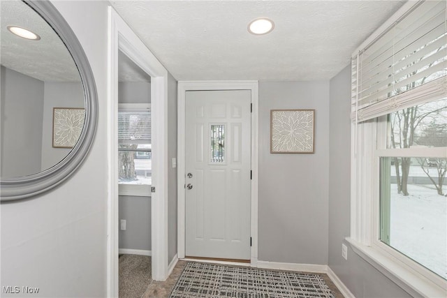 entryway featuring a textured ceiling