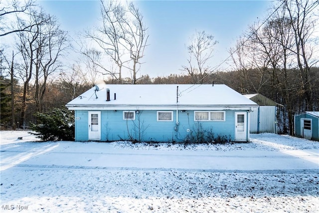 view of snow covered house