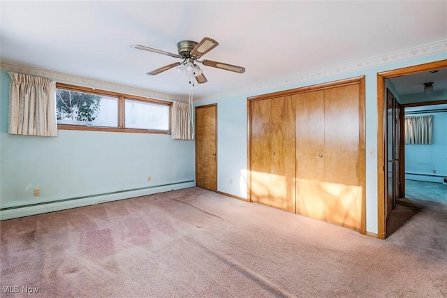 unfurnished bedroom featuring ceiling fan, carpet floors, and a baseboard heating unit