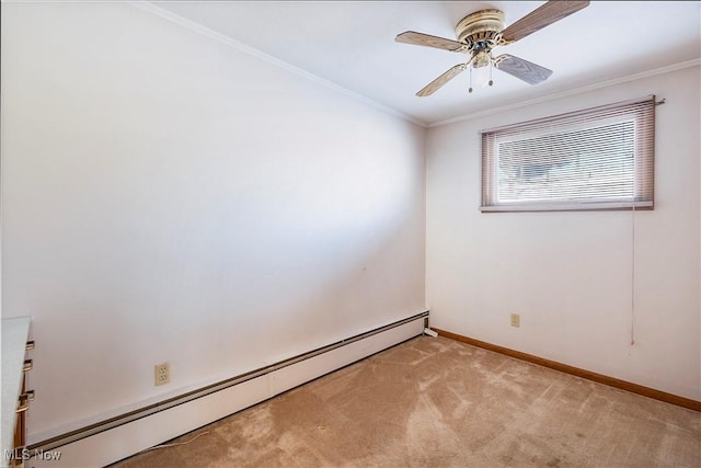 spare room featuring light carpet, ceiling fan, ornamental molding, and a baseboard heating unit