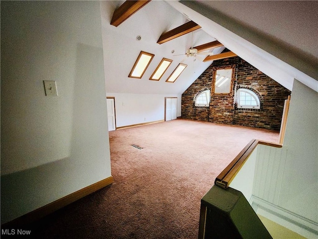 bonus room with beamed ceiling, ceiling fan, high vaulted ceiling, and carpet